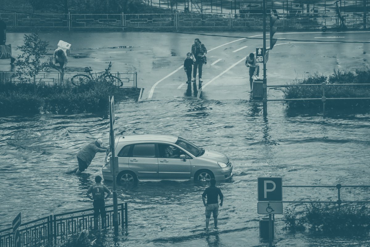 Flooded city street with pedestrians